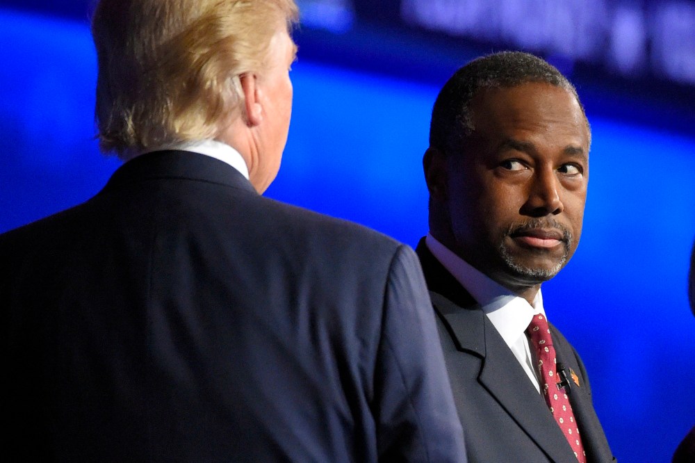 Ben Carson watches as Donald Trump takes the stage during the CNBC Republican presidential debate at the University of Colorado, Oct. 28, 2015, in Boulder, Colo. (Photo by Mark J. Terrill/AP)