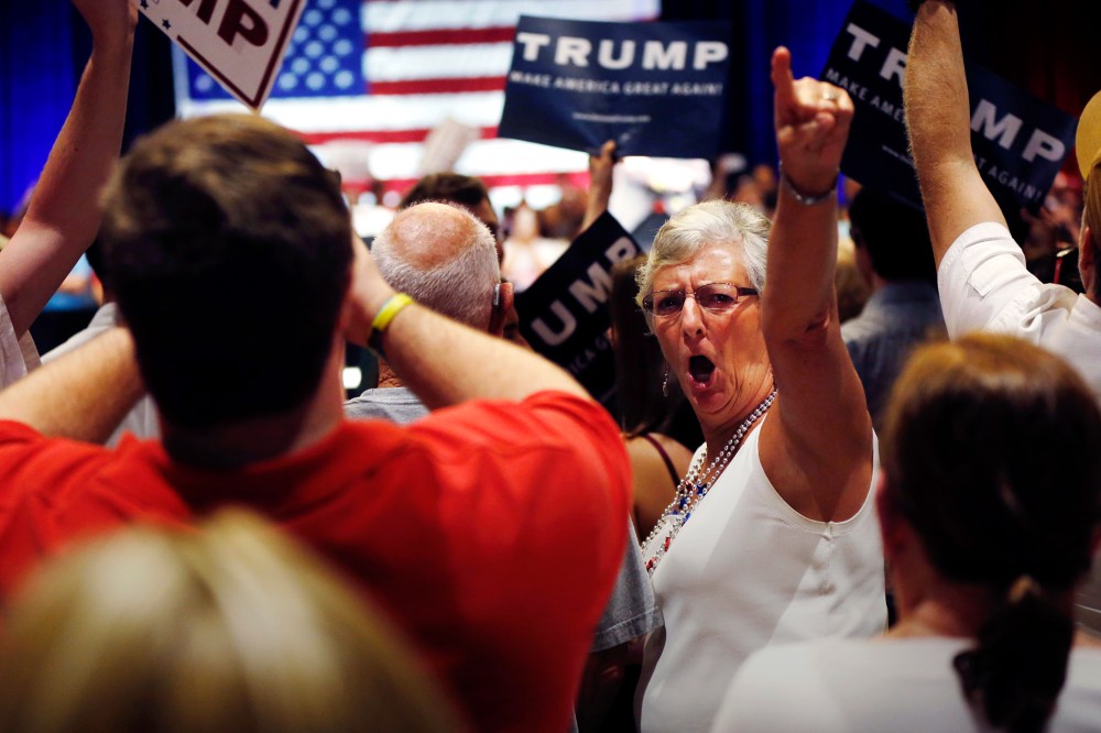 A woman turn around and gestures to the news media as former Alaska Gov. Sarah Palin talks about the news media at Donald Trump's campaign event in Tampa, Fla., March 14, 2016. (Photo by Gerald Herbert/AP)