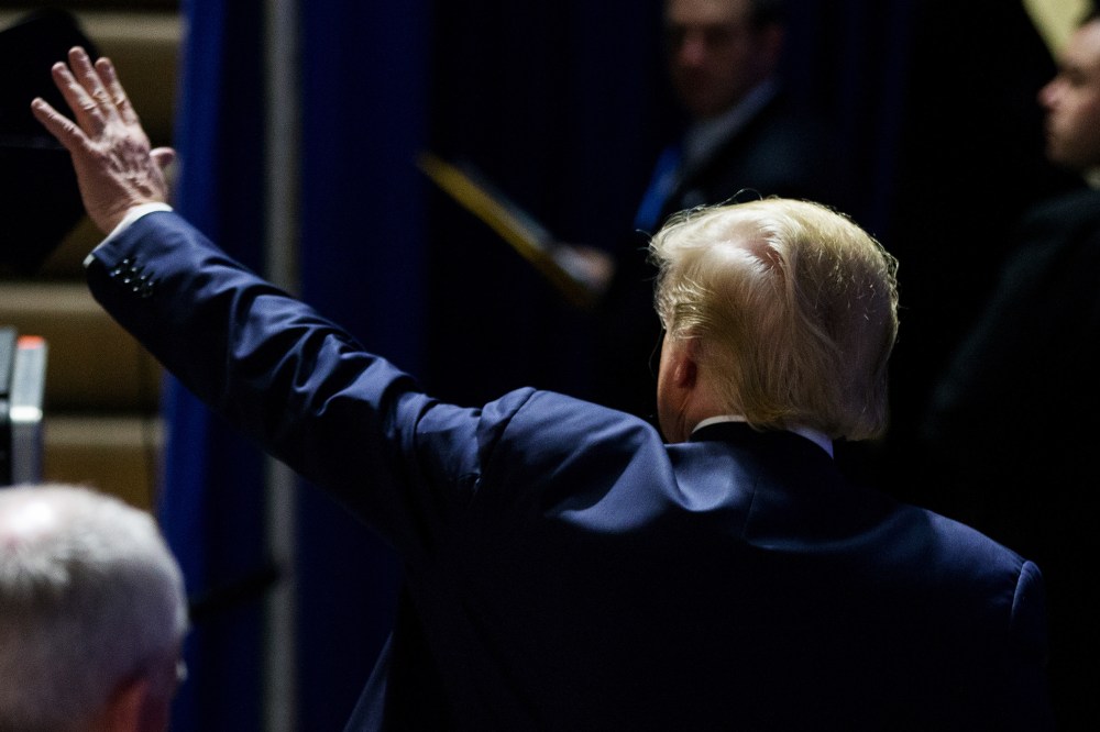 Republican presidential candidate Donald Trump waves to members of the audience as he departs after speaking at a rally at Muscatine High School in Muscatine, Iowa, Jan. 24, 2016. (Photo by Andrew Harnik/AP)