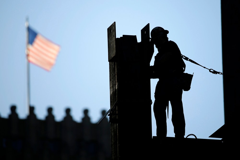 In this Sept. 15, 2015 photo, an iron worker works on a construction site in Philadelphia. (Photo by Matt Rourke/AP)