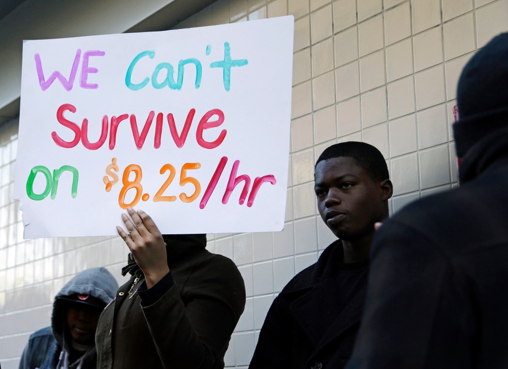 Protestors demonstrate outside a McDonald's restaurant on Thursday, Dec. 5, 2013, in Oakland, California.