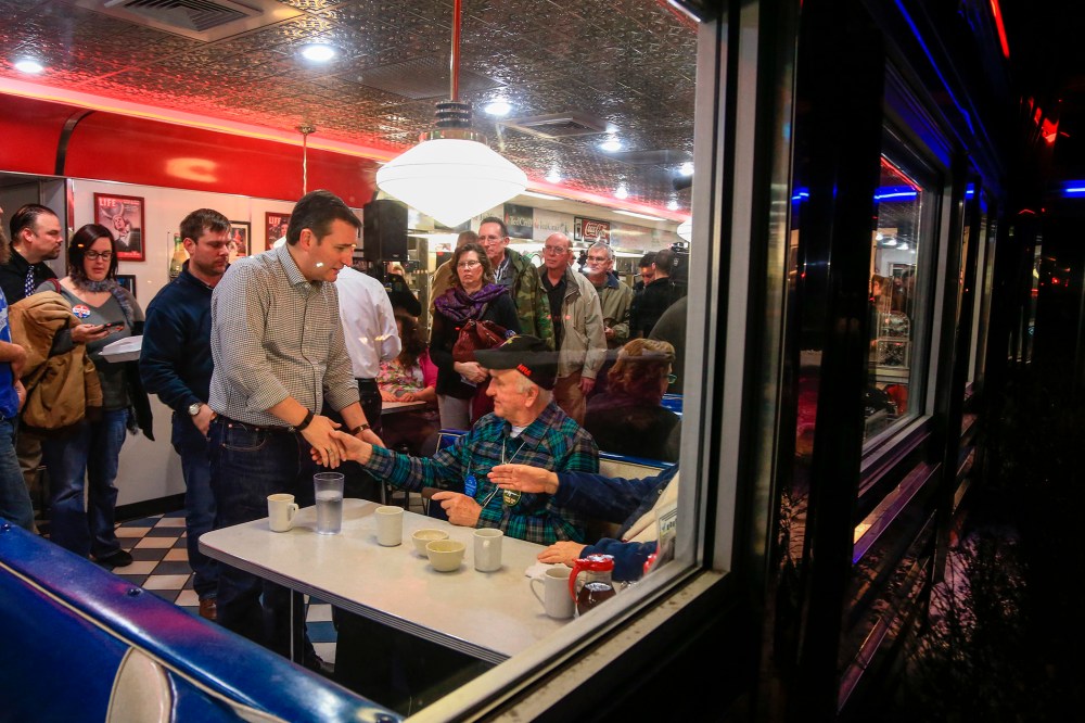 Republican Presidential candidate Sen. Ted Cruz, R-Texas, shakes the hand of Rex Haner, of Moorhead, Iowa, as he campaigns at Penny's Diner in Missouri Valley, Iowa, Jan. 4, 2016. (Photo by Nati Harnik/AP)