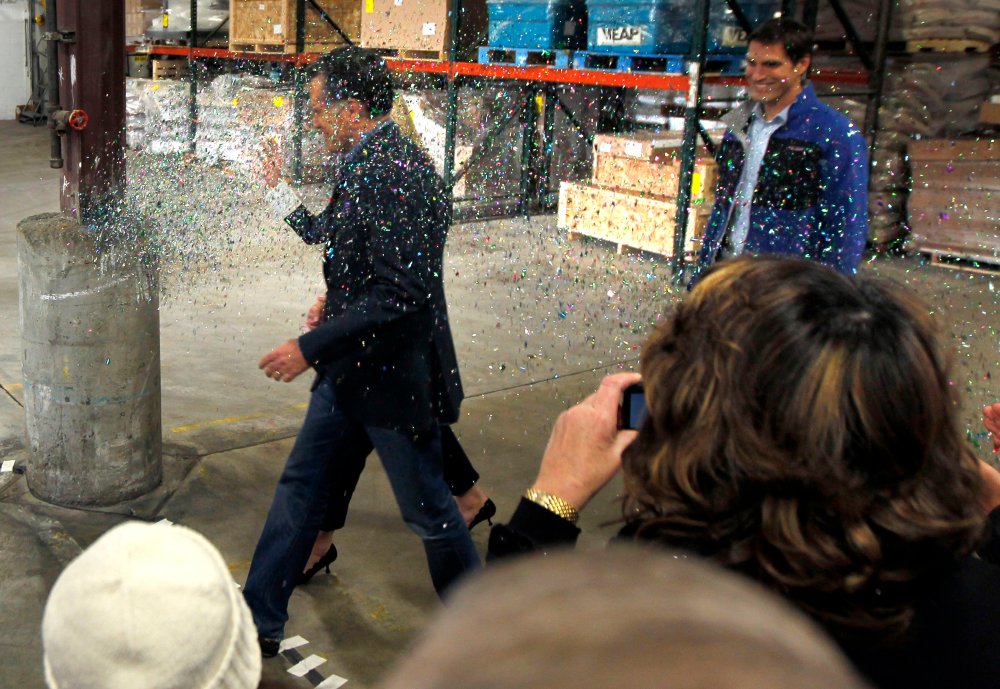 Mitt Romney gets "glitter bombed" at an event in Minnesota on Tuesday.