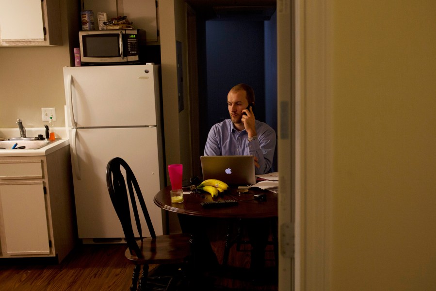 Tyler Pearson in a friend's apartment, where he is staying while attending grad school at the Clinton School of Public Service.