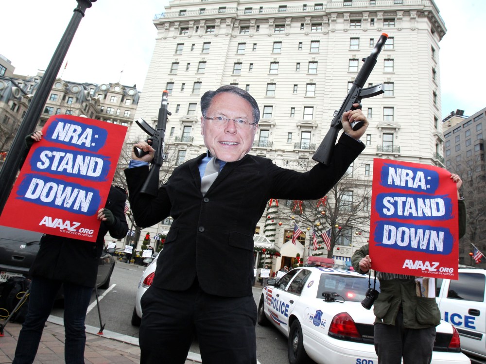 Members of the activist group Avaaz protest today's NRA press conference with a likeness of NRA CEO Wayne LaPierre Jr., calling on NRA affiliates like Days Inn and Super 8 to get "out of bed" with the gun lobby, outside the Willard Hotel in Washington,...