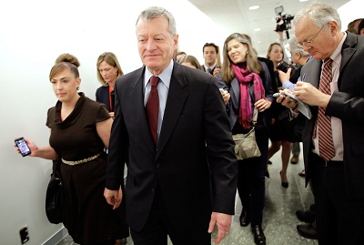 Sen. Max Baucus (D-MT) is trailed by reporters April 23, 2013 on Capitol Hill in Washington, DC. (Photo by Win McNamee/Getty Images)