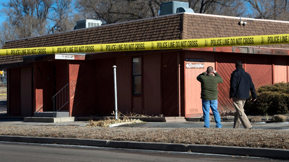 Colorado Springs police officers investigate the scene of an explosion Jan. 6, 2015, at Mr. G's Hair Salon at 603 S. El Paso Street in Colorado Springs, Colo.