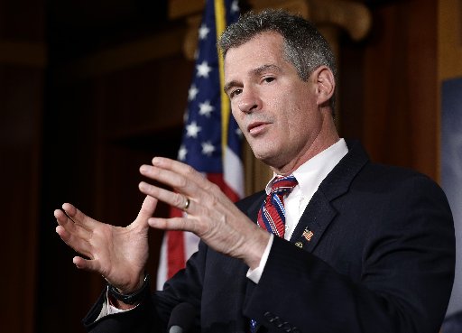 Sen. Scott Brown, R-Mass., speaks during a media availability, on Capitol Hill Tuesday, Nov. 13, 2012, in Washington.  (Photo by Alex Brandon/AP)
