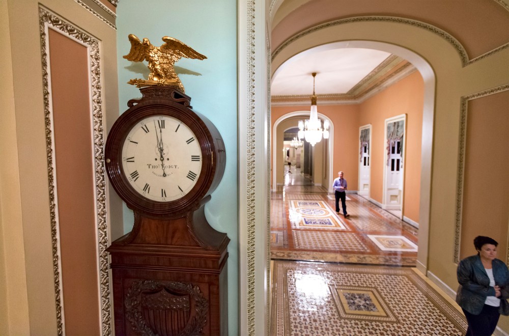 Just off the floor of the Senate, the hands on the famous Ohio Clock inch toward 12 midnight, the deadline for Congress to reach an agreement on funding the government, at the Capitol in Washington, September 30, 2013.