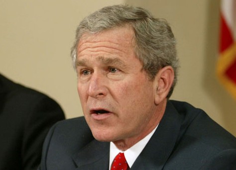 President Bush speaks to reporters, in this Jan. 30, 2004 photo, in the Roosevelt Room of the White House, while Vice President Dick Cheney looks on. (AP/Ron Edmonds, File)