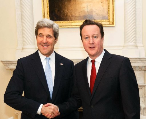 LONDON, ENGLAND - FEBRUARY 25: British Prime David Cameron (R) shakes hands with US Secretary of State John Kerry inside 10 Downing Street on February 25, 2013 in London, England. Mr Kerry is on an 11-day tour and is due to visit Berlin, Paris, Rome,...
