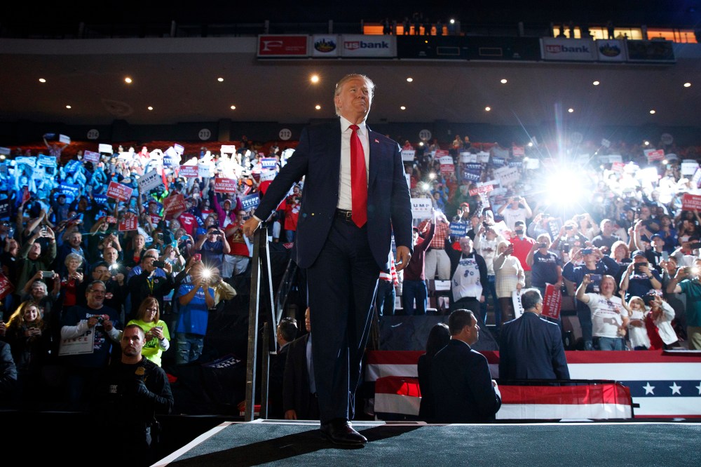 Republican presidential candidate Donald Trump arrives to speak at a campaign rally, Oct. 13, 2016, in Cincinnati, Ohio. (Photo by Evan Vucci/AP)