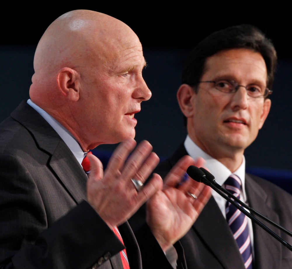 House majority leader Eric Cantor, R-Va., right, listens to Democratic challenger Wayne Powell during a Chamber of Commerce debate in Richmond, Va., Monday, Oct. 1, 2012.  (AP Photo/Steve Helber)