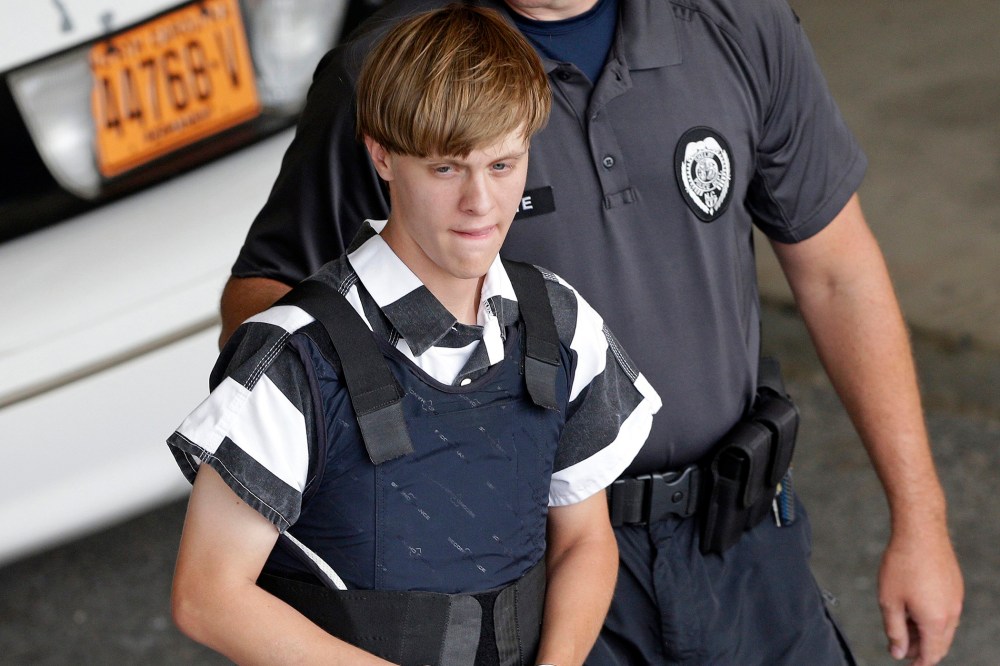 Charleston, S.C., shooting suspect Dylann Storm Roof is escorted from the Cleveland County Courthouse in Shelby, N.C., June 18, 2015. (Photo by Chuck Burton/AP)