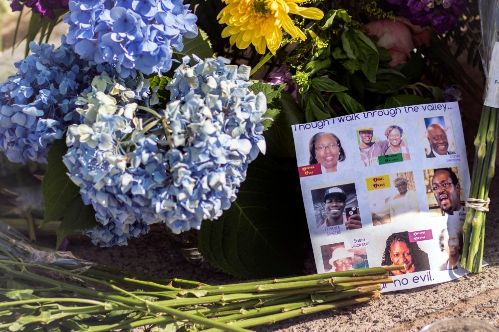 Flowers and notes of hope and support from the community line the sidewalk, June 19, 2015 in front of the Emanuel AME Church in Charleston, S.C. (Photo by Stephen B. Morton/AP)