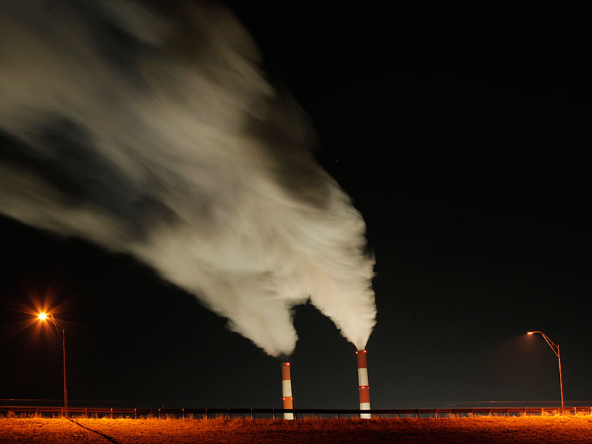 In this Jan. 19, 2012, file photo time exposure image smoke rises from the stacks of the La Cygne Generating Station coal-fired power plant in La Cygne, Kan. (Photo by Charlie Riedel/AP)