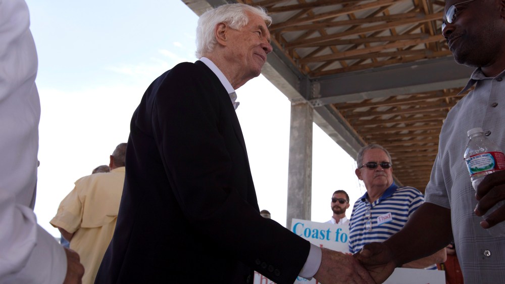Senator Thad Cochran (L) campaigns in the Gulf Coast city of Pass Christian, Mississippi, June 19, 2014.