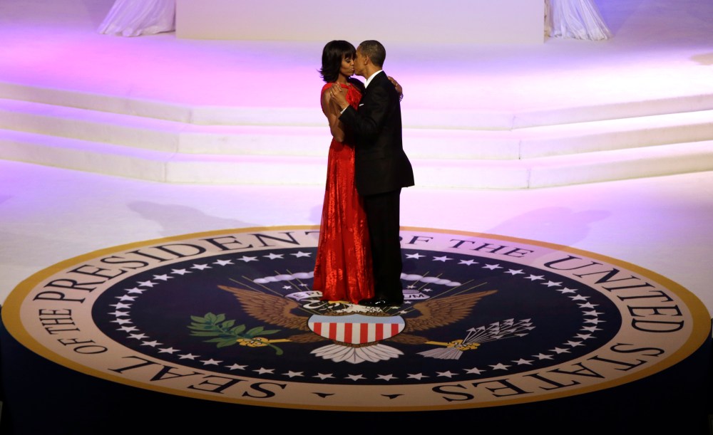 President Barack Obama and first lady Michelle Obama kiss as they dance during the Commander-In-Chief inaugural ball at the Washington Convention Center during the 57th Presidential Inauguration on Monday, Jan. 21, 2013 in Washington. (Photo by Evan...