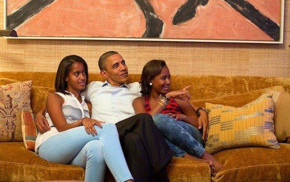President Obama watches Mrs. Obama's DNC address on television from the White House with daughters Malia (left) and Sasha