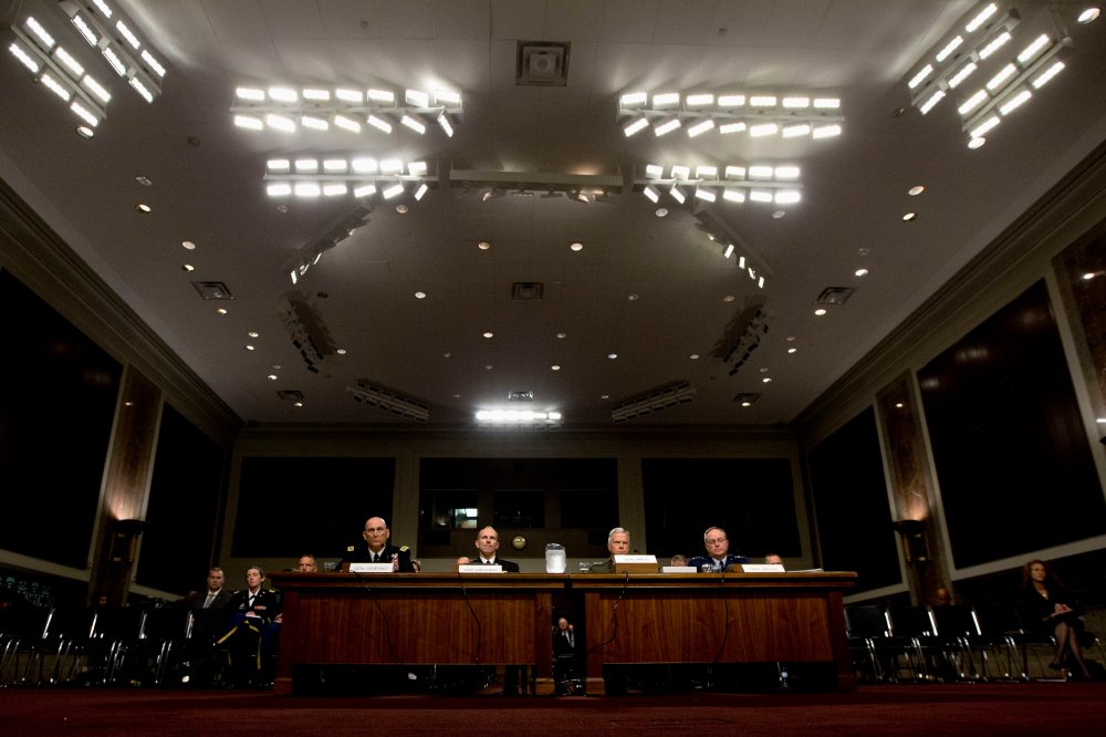 Pentagon officials are seen on Capitol Hill in Washington, Thursday, Nov. 7, 2013.