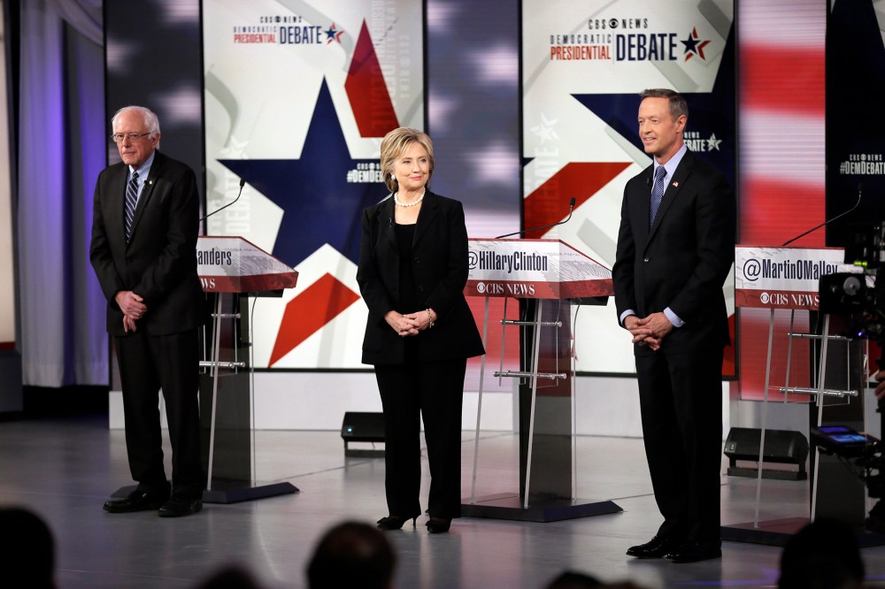 Democratic presidential candidates Bernie Sanders, left, Hillary Rodham Clinton and Martin O'Malley take the stage before a Democratic presidential primary debate, Nov. 14, 2015, in Des Moines, Iowa. (Photo by Charlie Neibergall/AP)