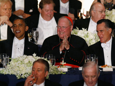President Obama and Mitt Romney are pictured with Cardinal Timothy Dolan at the 67th Annual Alfred E. Smith Memorial Foundation dinner in New York on Thursday. (Jason Reed/Reuters)