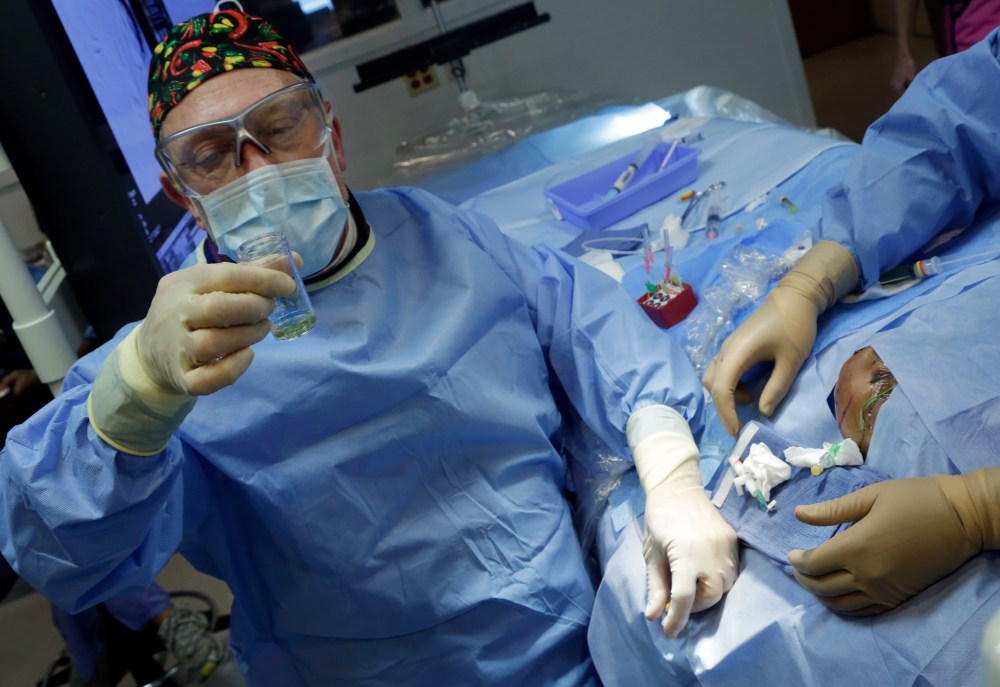 Dr. Alejandro Berenstein, Director at the Center for Endovascular Surgery in an operating room of New York's Roosevelt Hospital, Tuesday, March 5, 2013. (AP Photo/Richard Drew)