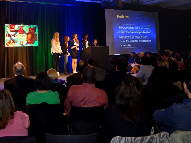 A team of girls presents a cell phone application at Technovation Pitch Night in New York City in April 2012.