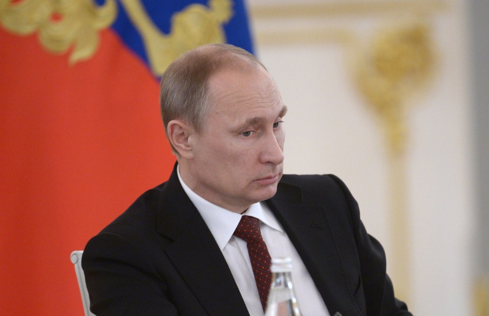 Russian President Vladimir Putin chairs a government meeting at the Kremlin in  Moscow, on March 24, 2014.