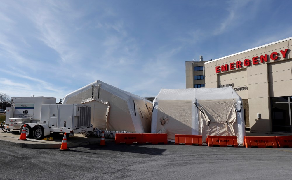 A tent is set up for a patients with flu symptoms, just outside the emergency entrance at the Lehigh Valley Hospital Thursday, Jan. 10, 2013, in Allentown, Pa. The Pennsylvania Department of Health designated flu as now "widespread" throughout the...