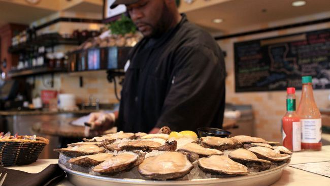 Rickey Lee shucks Louisiana oysters from area 7 at the Bourbon House restaurant on June 9, 2010 in New Orleans, Louisiana. Restaurants like the Bourbon House in the heart of the French Quarter are still serving fresh oysters daily. Due to the ongoing...
