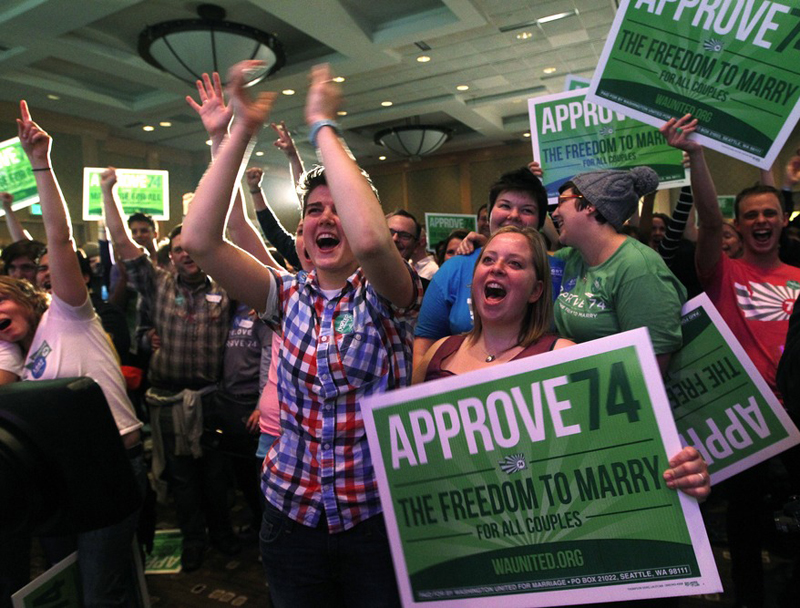 Supporters cheer at an election watch party for proponents of Washington's Referendum 74, which would uphold the state's new same-sex marriage law, Tuesday, Nov. 6, 2012, in Seattle. (AP Photo/Elaine Thompson)