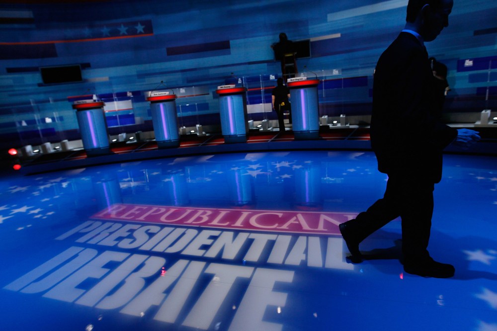Workers prepare the stage for the GOP Presidential Candidates Debate (Photo by Joe Raedle/Getty).