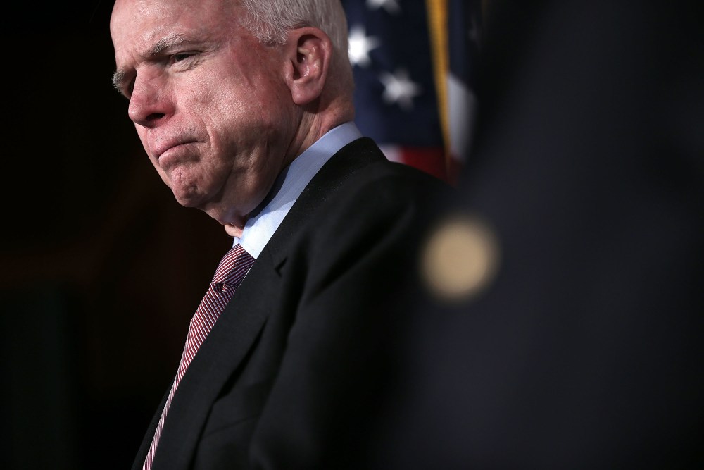 U.S. Senator John McCain (R-AZ) listens during a news conference on the terror attack that killed four Americans in Benghazi Feb. 14, 2013 on Capitol Hill in Washington, DC. (Photo by Alex Wong/Getty)