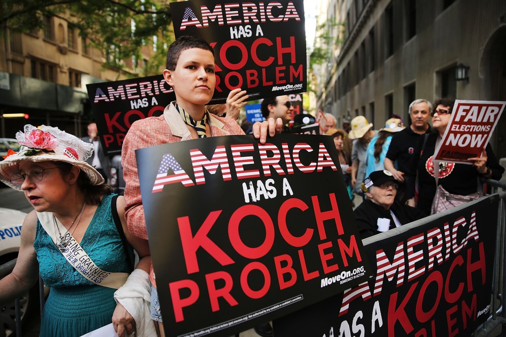 Activists hold a protest near the Manhattan apartment of billionaire and Republican financier David Koch on June 5, 2014 in New York City. (Photo by Spencer Platt/Getty)