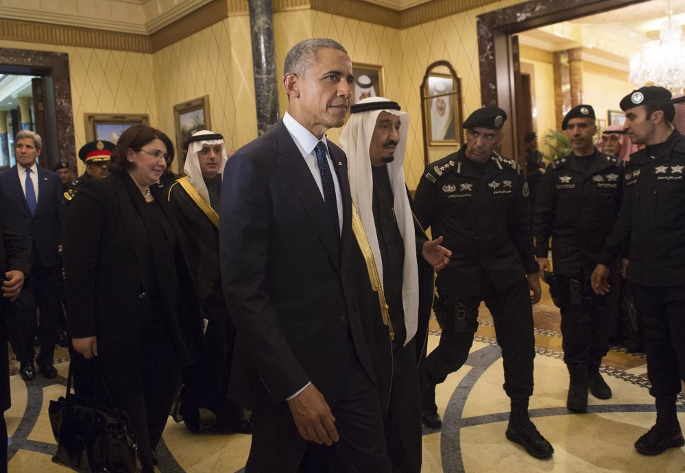 U.S. President Obama walks alongside Saudi's newly appointed King Salman at Erga Palace in Riyadh on Jan. 27, 2015 following his arrival in Saudi Arabia. (Photo by Saul Loeb/AFP/Getty)