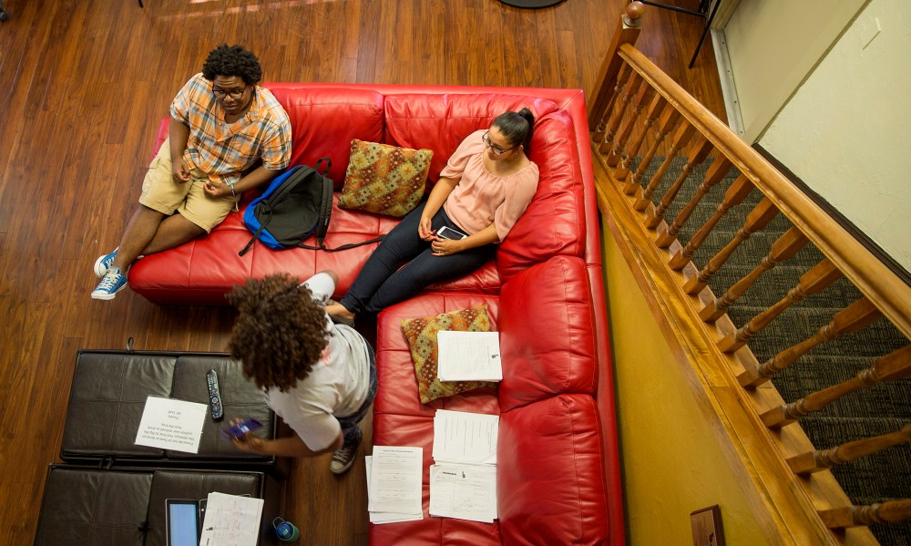 Dashari Kearse, 20, (Left) Maria Neris, 20, (Right) and Susan Ajayi, 21, (Foreground) talk inside the Institute of Black Culture Center in Gainesville, Fla. (Photo by Willie J. Allen Jr./Getty)