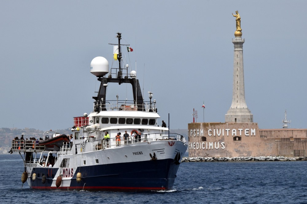 The Migrant Offshore Aid Station vessel arrives in the port of Messina, on May 16, 2015 following rescue operations of migrants at sea off the coast of Sicily in partnership with NGO Doctors Without Borders. (Photo by Giovanni Isolino/AFP/Getty)