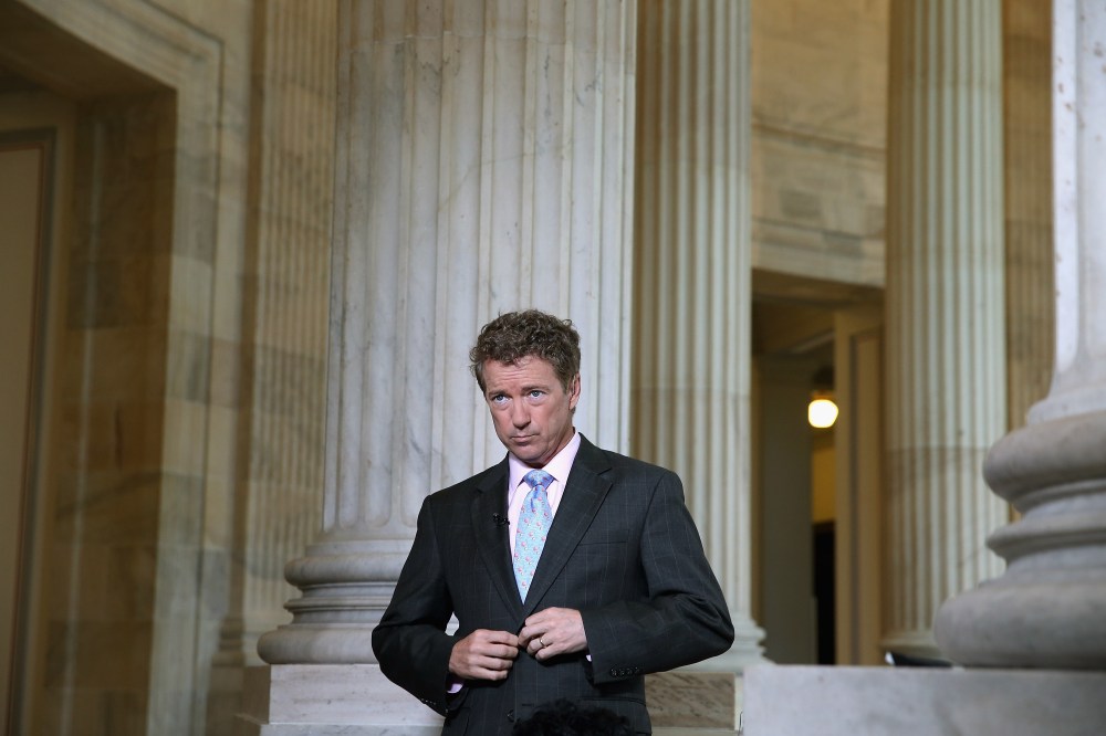 U.S. Sen. Rand Paul (R-KY) prepares to do a live interview with FOX News in the Russell Senate Office Building rotunda on Capitol Hill June 1, 2015 in Washington, DC. (Photo by Chip Somodevilla/Getty)