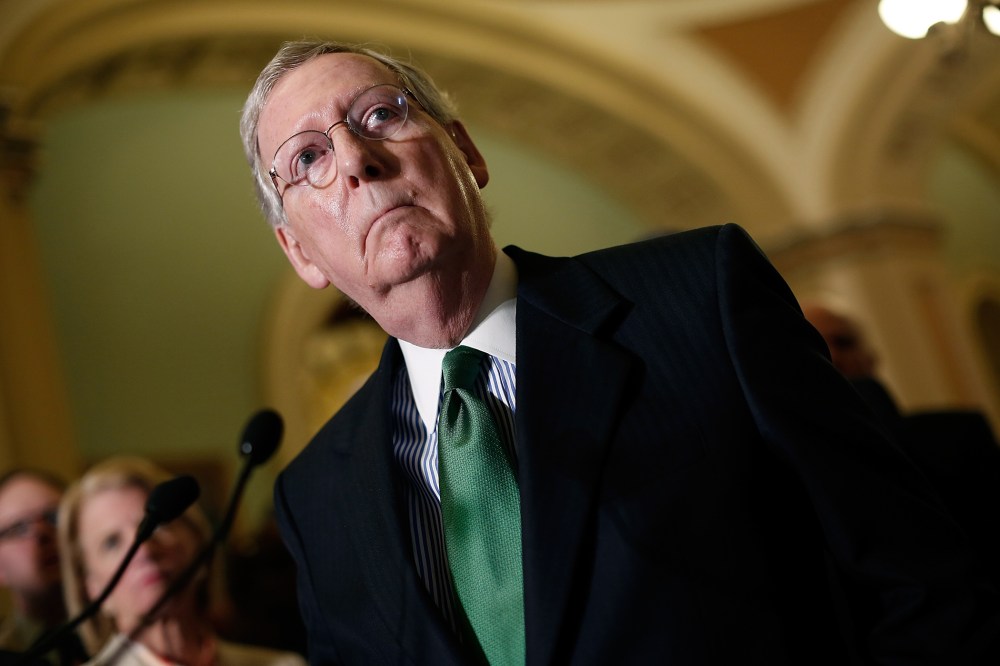 Senate Majority Leader Mitch McConnell answers questions as members of the Republican leadership speak about the Defense Authorization Bill following caucus luncheons at the U.S. Capitol on June 9, 2015 in Washington, DC. (Photo by Win McNamee/Getty)