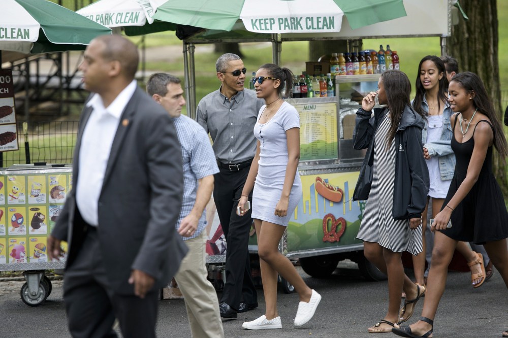 US President Barack Obama walks with daughters Sasha Obama (C) and Malia Obama (2R) and others in Central Park on July 18, 2015 in New York, N.Y. (Photo by Brendan Smialowski/AFP/Getty)