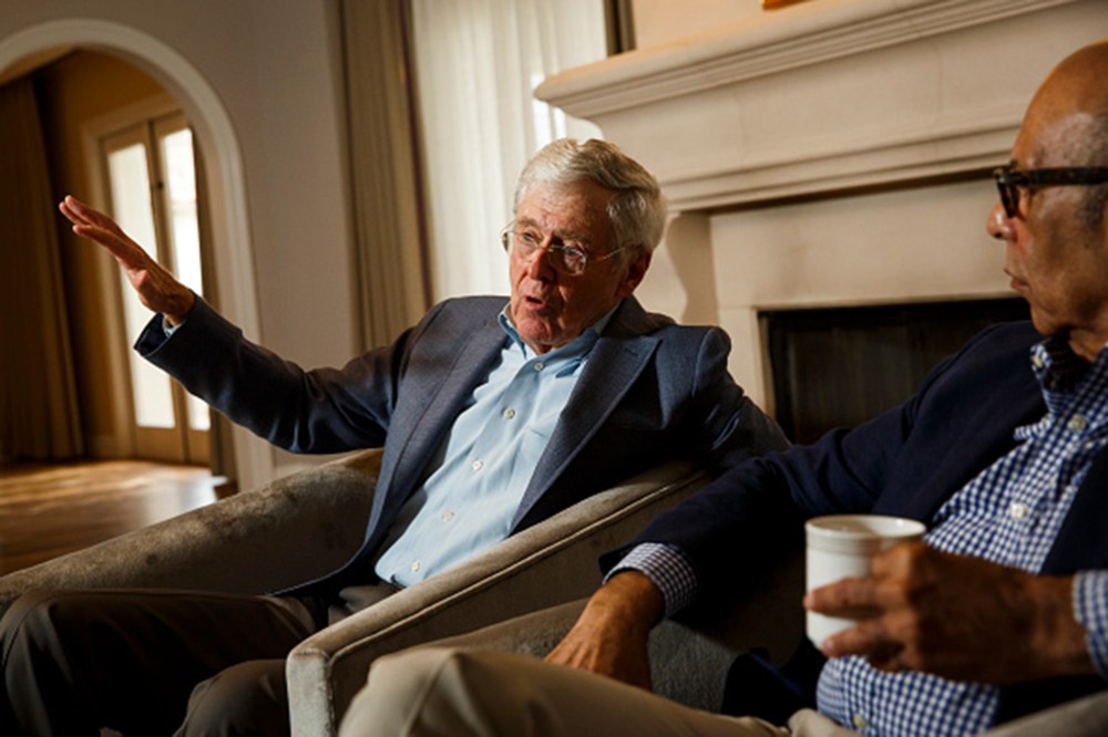 Charles Koch and Dr. Michael Lomax, president and chief executive officer of the United Negro College Fund, speak during an interview at the Freedom Partners Summit on Aug. 3, 2015 in Dana Point, CA. (Photo by Patrick T. Fallon/The Washington Post/Getty)