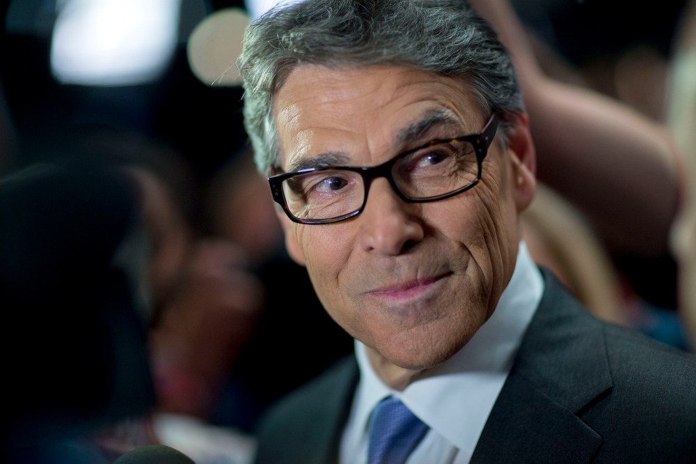 Rick Perry, 2016 Republican presidential candidate, pauses while speaking to the media in the spin area after a televised forum ahead of the first Republican presidential debate in Cleveland, Ohio, Aug. 6, 2015. (Photo by Andrew Harrer/Bloomberg/Getty)