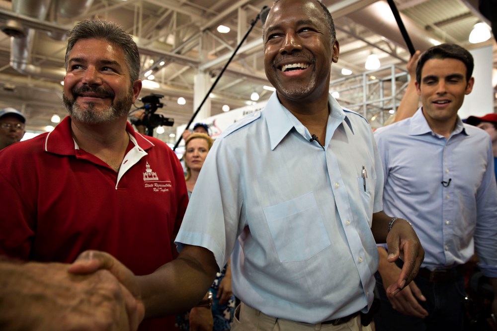 Ben Carson, 2016 Republican presidential candidate, greets attendees as he tours the Iowa State Fair in Des Moines, Ia., Aug. 16, 2015. (Photo by Daniel Acker/Bloomberg/Getty)