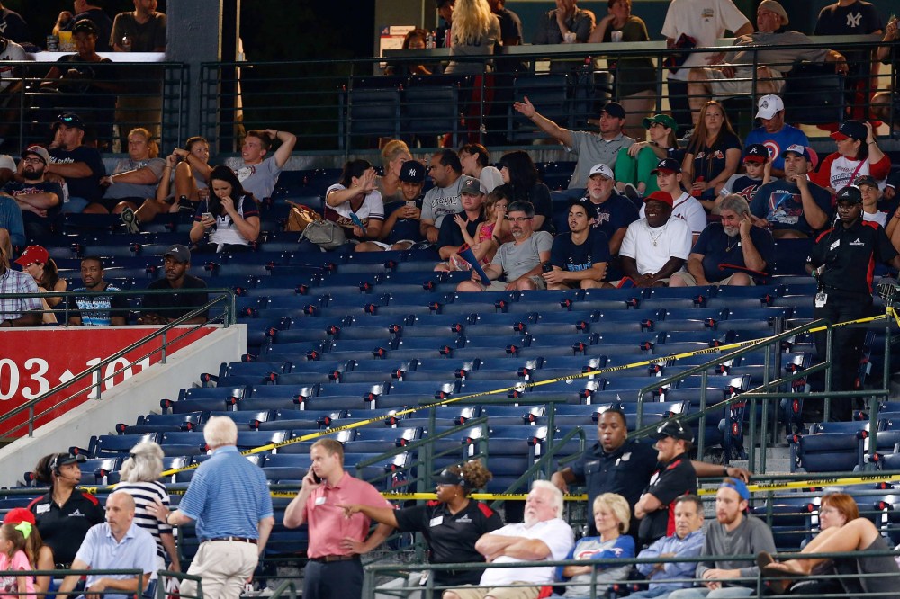 Police block off a section with police tape after a fan fell from the upper deck of Turner Field in the seventh inning during the game between the Atlanta Braves and the New York Yankees on Aug. 29, 2015 in Atlanta, Ga. (Photo by Mike Zarrilli/Getty)
