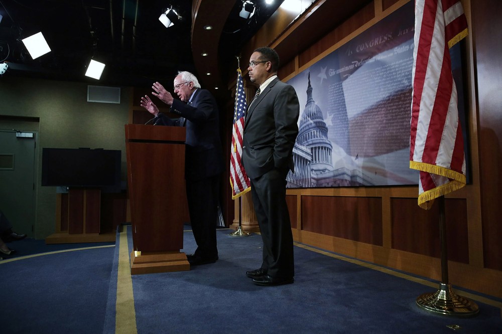 U.S. Sen. Bernie Sanders and Rep. Keith Ellison speak during a news conference about private prisons, Sep. 17, 2015 on Capitol Hill. The legislators announced that they will introduce bills to ban private prisons. (Photo by Alex Wong/Getty)