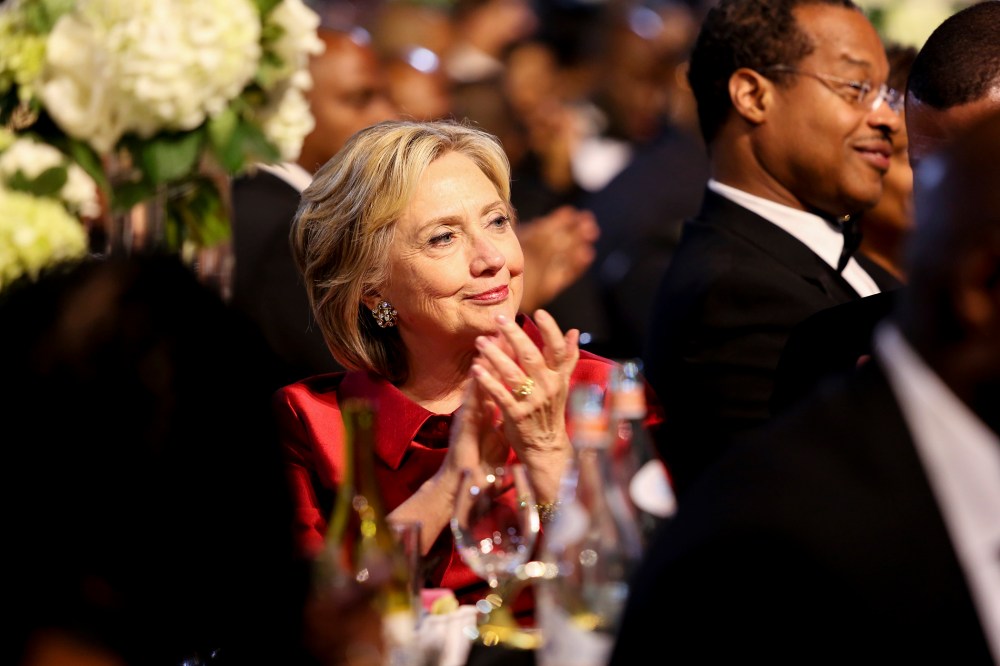 Democratic presidential candidate Hillary Clinton applauds a speaker at the Congressional Black Caucus Foundation's 45th Annual Legislative Conference Phoenix Awards Dinner, Sept. 19, 2015 in Washington, DC. (Photo by Aude Guerrucci/Pool/Getty)