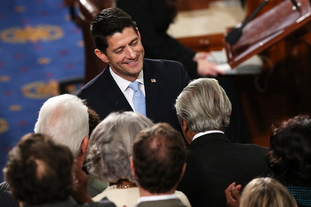 Speaker of the House Paul Ryan (R-WI) is congratulated by fellow members of the U.S. House of Representatives on the floor of the House chamber, Oct. 29, 2015 in Washington, DC. (Photo by Win McNamee/Getty)