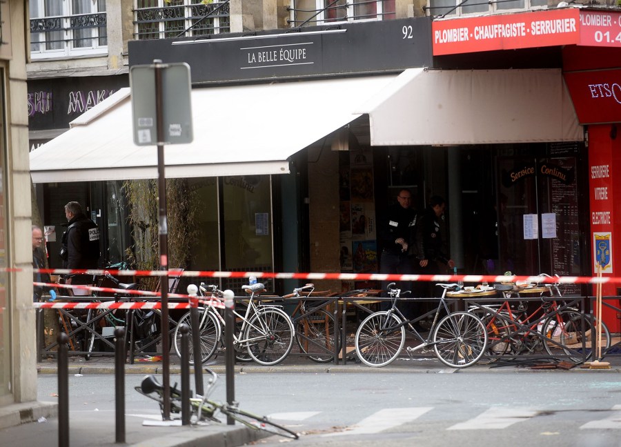 Police officers investigate La Belle Equipe bar after a deadly attack on Nov. 14, 2015 in Paris, France. (Photo by Antoine Antoniol/Getty)