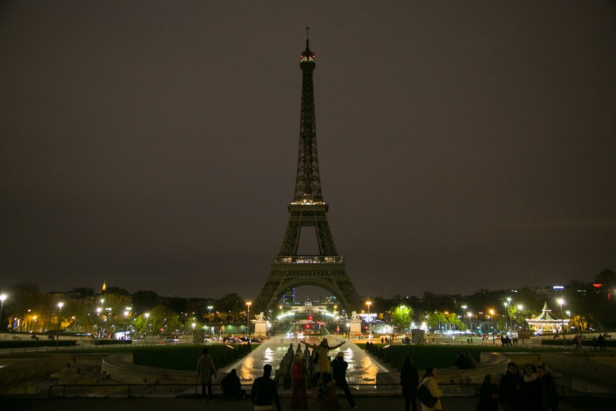 The Eiffel Tower turns off its lights in memory of the more than 120 victims the day after the terrorist attack on Nov. 14, 2015 in Paris, France. (Photo by Marc Piasecki/Getty)